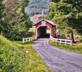 Red Covered Bridge on a peaceful country road. Royalty Free Stock Photo