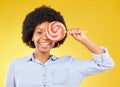 Cover, candy and lollipop with black woman in studio for colorful, cheerful and positive. Young, happiness and dessert
