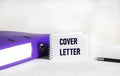Cover letter text concept on notepad and white background with document folder Royalty Free Stock Photo
