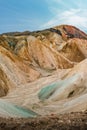 Cover page with colorful Icelandic rainbow volcanic Landmannalaugar mountains at famous Laugavegur hiking trail in Iceland, blue