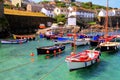 Coverack Cornwall beautiful small harbour colourful coast fishing village with boats Royalty Free Stock Photo