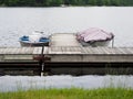 Covered Boats Tied to Lake Dock