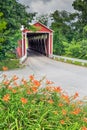 Covered Bridge and Orange Daylilies Royalty Free Stock Photo