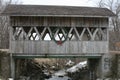Covered Bridge over a frozen creek Royalty Free Stock Photo