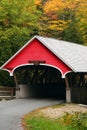 A Covered Bridge Is Surrounded By New England Fall Foliage