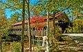 Covered bridge Vermont attractive setting green foliage Royalty Free Stock Photo