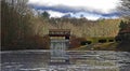 Covered Bridge and Waterfall with Reflecting Lake