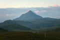 Covered by clouds illuminated by the rising sun, the summit of Mount Ben Stack Royalty Free Stock Photo