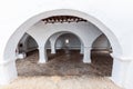 Covered courtyard in Puig de Missa reveals serene white arches, Santa Eulalia Royalty Free Stock Photo