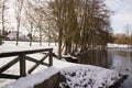 Covered in frost lake, snow and one bridge - France Royalty Free Stock Photo