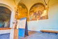 The covered gallery of Dukes residence with medieval sculpture and preserved frescoes, Sforza`s Castle, on April 5 in Milan, Ital Royalty Free Stock Photo