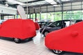 Covered new cars in the sales area of a car dealership Royalty Free Stock Photo