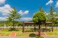 Covered park benches in graveyard Royalty Free Stock Photo