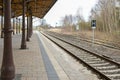 Covered platform with vintage metal columns at the railroad tracks on the small country station in Schonberg, Mecklenburg, Germany