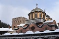 Covered by snow dome of Rila Monastery, Bulgaria Royalty Free Stock Photo