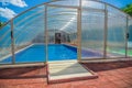 Covered summer pool. The covered area of the outdoor pool for hotel. Water retains heat longer and protect from the wind