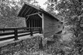 Covered bridge over mountain creek in black and white Royalty Free Stock Photo