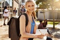 Covering all the bases before her exam. Portrait of a student studying on campus with other students blurred in the Royalty Free Stock Photo