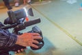 Covering an event with a video camera., Videographer takes video camera with free copy space for text., Video camera operator Royalty Free Stock Photo