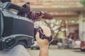 Covering an event with a video camera., Videographer Royalty Free Stock Photo