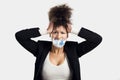 Covering mouth with a euro banknote