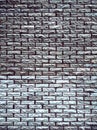 Covering the wall surface with imitation bricks of gray and brown colors Royalty Free Stock Photo