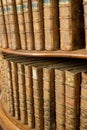 Covers of old medieval books on shelf in bookcase