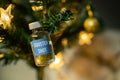 Covid-19 booster shot vaccine on a Christmas tree Royalty Free Stock Photo