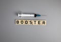 Covid-19 booster shots vaccine text on Gray background Covid-19 booster shots, with syringe top view and copy space