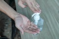 COVID-19 Close up hands using wash hand sanitizer gel dispenser, Royalty Free Stock Photo