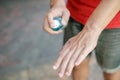 COVID-19 Close up hands using wash hand sanitizer gel dispenser, Royalty Free Stock Photo