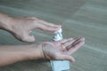 COVID-19 Close up hands using wash hand sanitizer gel dispenser, Royalty Free Stock Photo