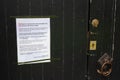 A covid-19 closure notice on a church door