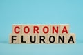 Covid-19 corona and flu flurona symbol. Cube and changed the word corona to flurona. Blue background. Medical, covid-19