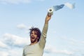 Covid, corona virus. WC and restroom. Sterility and purity. Man with happy face hold toilet paper on blue sky. Hygiene Royalty Free Stock Photo