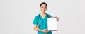 Covid-19, coronavirus disease, healthcare workers concept. Smiling pretty asian female physician, nurse showing test Royalty Free Stock Photo