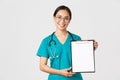 Covid-19, coronavirus disease, healthcare workers concept. Smiling pretty asian female physician, nurse showing test Royalty Free Stock Photo