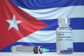 COVID-19 coronavirus disease vaccine vial and syringe against the Cuban flag. Medical research and vaccination in Cuba