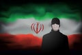 COVID-19 coronavirus epidemic in iran. Silhouette of man in medical mask on abstract iranian flag background. Global COVID-19