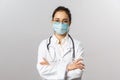 Covid19, coronavirus, healthcare and doctors concept. Portrait of professional confident young asian doctor in medical Royalty Free Stock Photo