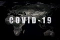 COVID-19 coronavirus pandemic, name COVID-19 on dark global map. SARS-CoV-2 coronavirus outbreak in world. Rapid spread of deadly Royalty Free Stock Photo