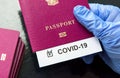 COVID-19 coronavirus pandemic and travel concept, COVID-19 note in passport. Novel corona virus outbreak, spread of epidemic from Royalty Free Stock Photo