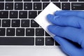 COVID-19 Coronavirus Prevention Concept Disinfection of Workspace Person Cleaning Laptop Keybord with Disinfecting Wipes Royalty Free Stock Photo