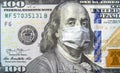 COVID-19 coronavirus in USA, 100 dollar money bill with face mask. Coronavirus affects global stock market Royalty Free Stock Photo