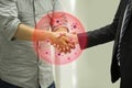 Covid-19 and Coronavirus ,Virus in hands concept.Business people shaking hands traditional in Europe with coronavirus.Concept for