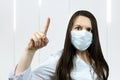 Covid19, coronavirus, woman doctor point finger with idea, wear medical mask to prevent catching virus, white coat