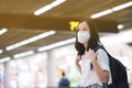 COVID-19 Crisis, Asian travelers girl and surgical mask in airports