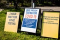 COVID-19 drive through testing clinic sign. 2 hours wait for testing sign Royalty Free Stock Photo