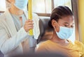 Covid, health black woman travel on bus smiling, social distancing for safety in pandemic virus. Happy women diversity Royalty Free Stock Photo