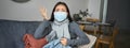 Covid-19 and health concept. Young asian woman in medical face mask, feels sick and unwell, catching flu, protecting